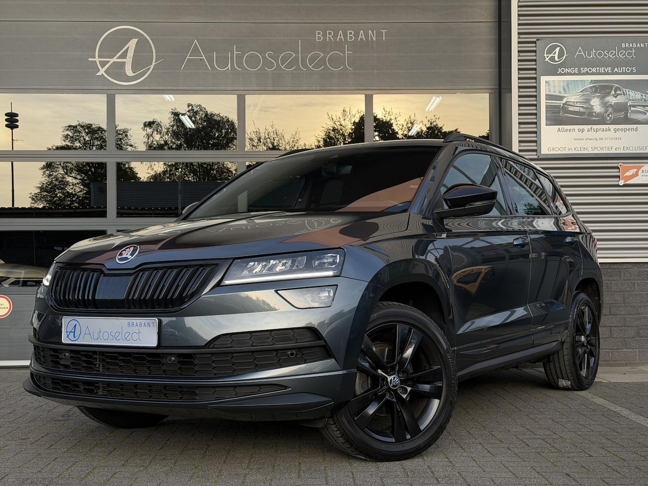 Skoda Karoq - 1.5 TSI ACT Sportline Navi | Camera | Dealer onderhouden - AutoWereld.nl