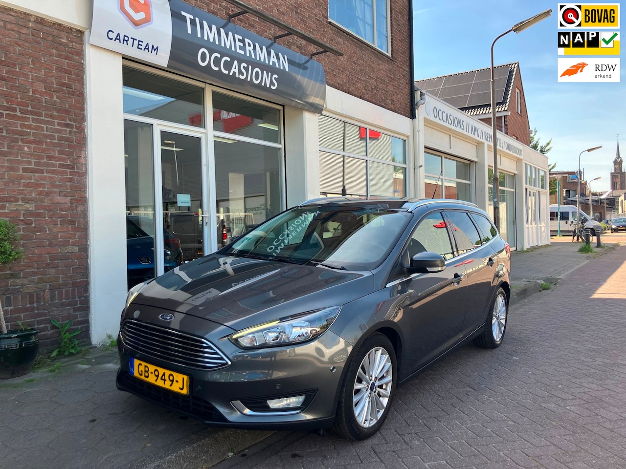 Ford Focus Wagon - 1.0 Titanium Edition|Cruise Ctrl|PDC|Trekhaak - AutoWereld.nl