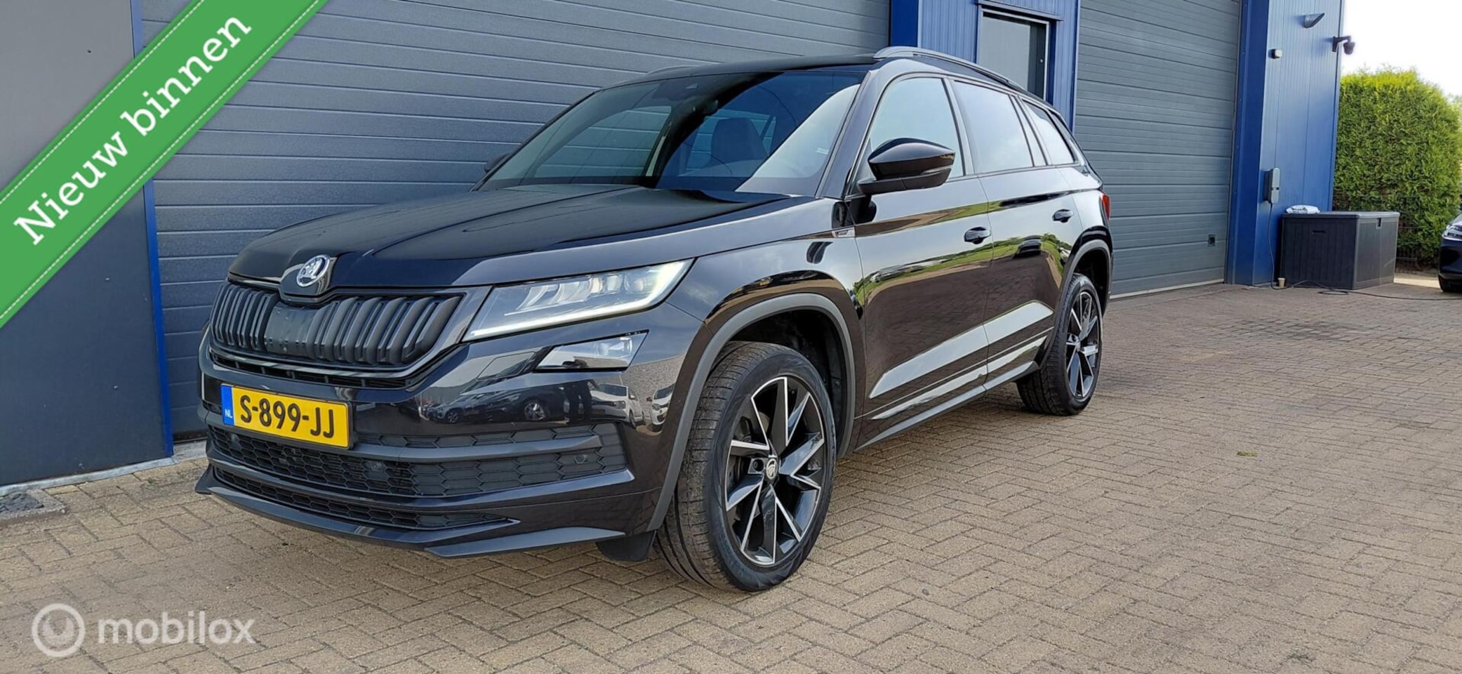 Skoda Kodiaq - 1.5 TSI Sportline,Pano,Canton,Trekhaak - AutoWereld.nl
