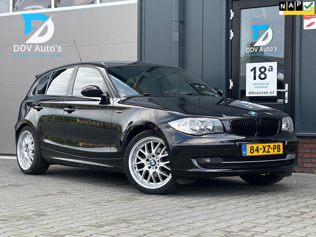 BMW 1-serie - 118i/143pk High Executive|NAP|Schuif-/Kanteldak|PDC|Cruise|Climate Control|Bruin Leder|Nav - AutoWereld.nl