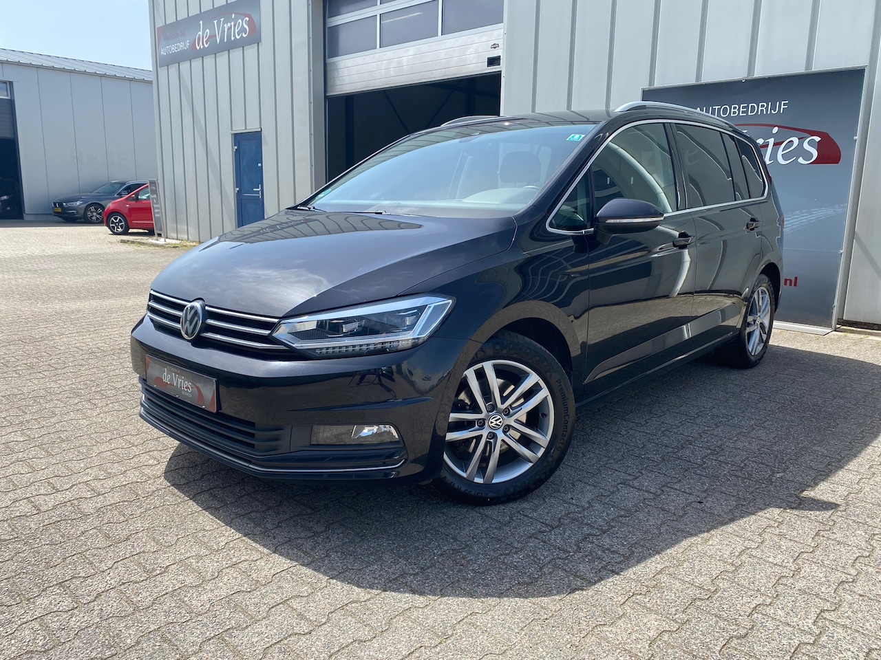 Volkswagen Touran - 1.4 TSI Highline 7 Pers. / Clima / Adapt. Cruise / Navi / Stoelverw. / Trekhaak - AutoWereld.nl