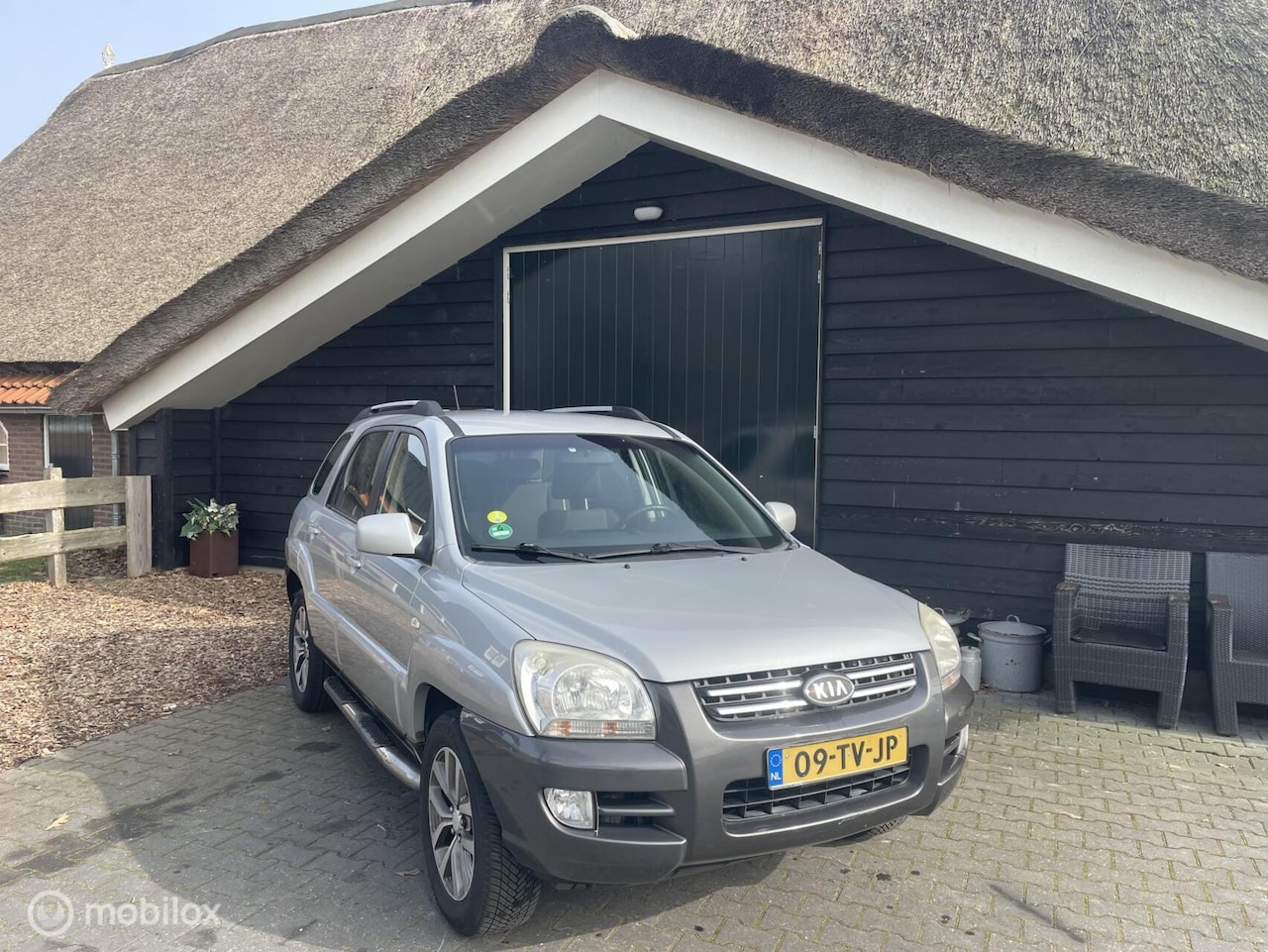 Kia Sportage - 2.0 CVVT Comfort 2.0 CVVT Comfort - AutoWereld.nl
