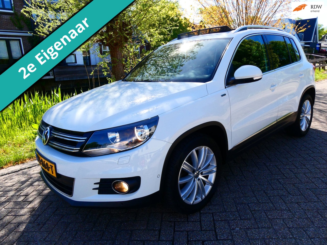 Volkswagen Tiguan - 1.4 TSI R-Line 122pk 2e eig. Clima Navi PDC Pano Xenon - AutoWereld.nl
