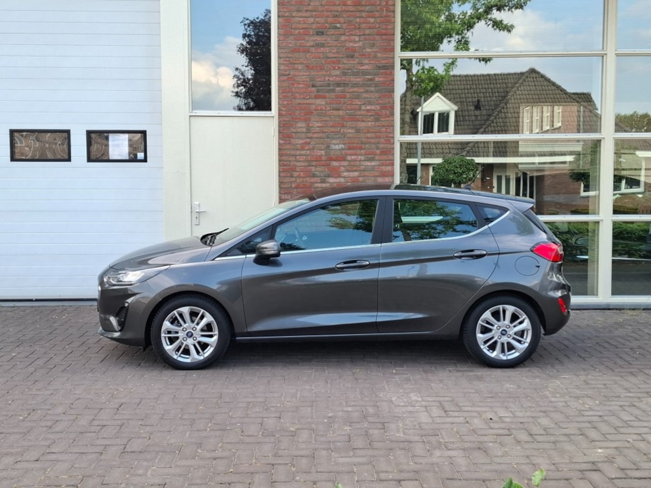Ford Fiesta - 1.0 EcoBoost 92 KW HYBRID TITANIUM 2 jaar garantie - AutoWereld.nl