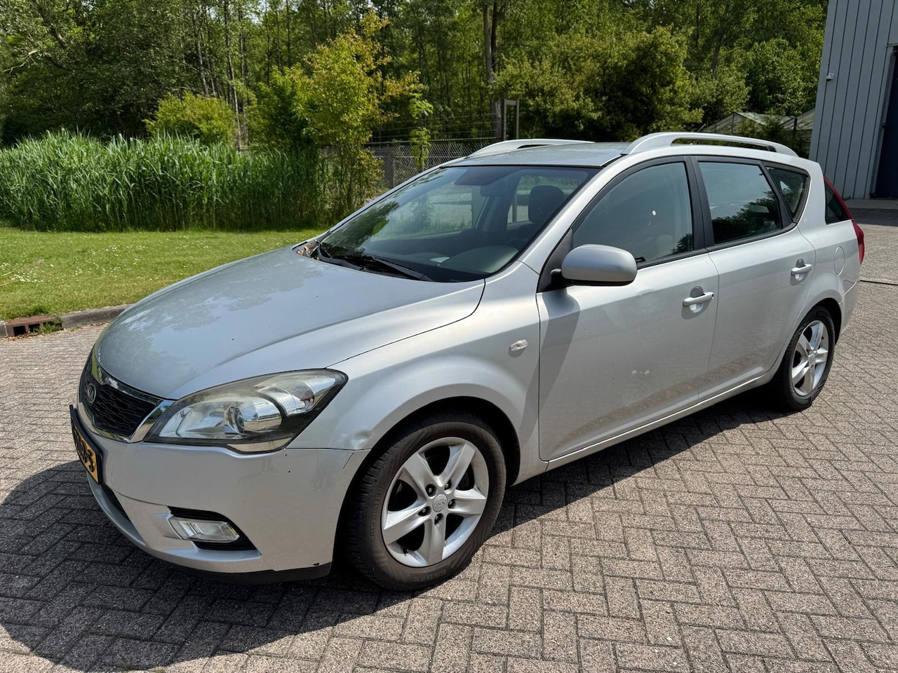 Kia Cee'd Sporty Wagon - 1.4 CVVT Navigator Plus Pack NAVI CRUISE CAMERA TREKHAAK AFNEEMBAAR - AutoWereld.nl