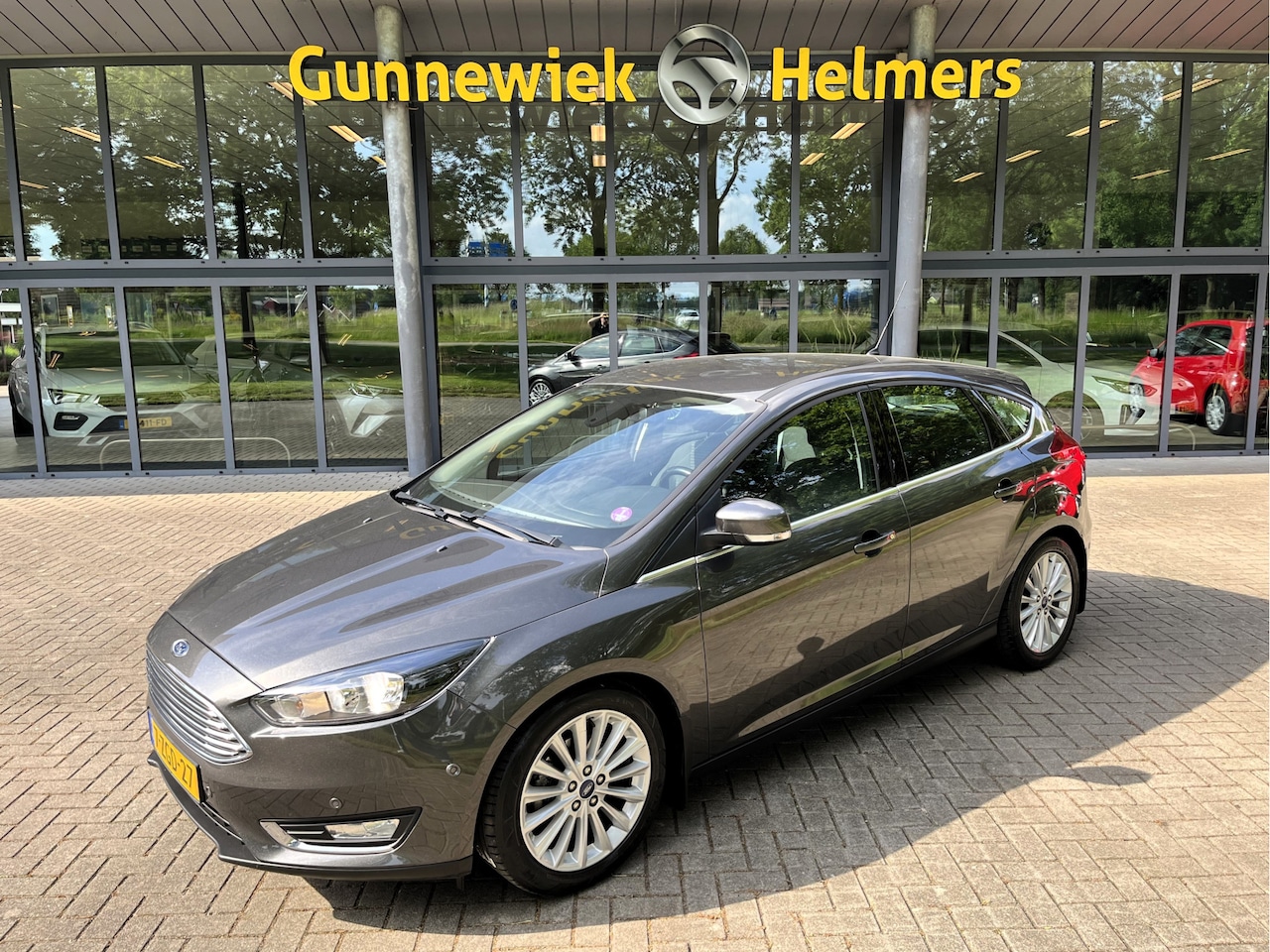 Ford Focus - 1.0 Titanium Edition | BT | CRUISE | CLIMA | NAVI | PDC V&A | TREKHAAK | VOORUITVERW. - AutoWereld.nl