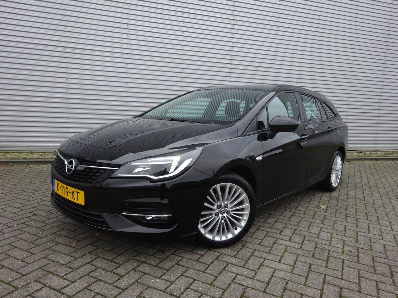Opel Astra Sports Tourer - 1.2 Business Edition 1e Eigenaar - Airco / Navi / Cruise / Parkeers. / Trekhaak /  Lm velg - AutoWereld.nl