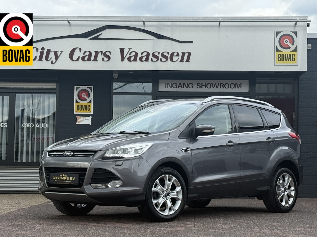 Ford Kuga - 1.6 Titanium 150 pk org nl auto nap logisch climate ctr cruise ctr half leder pdc v/a afn - AutoWereld.nl
