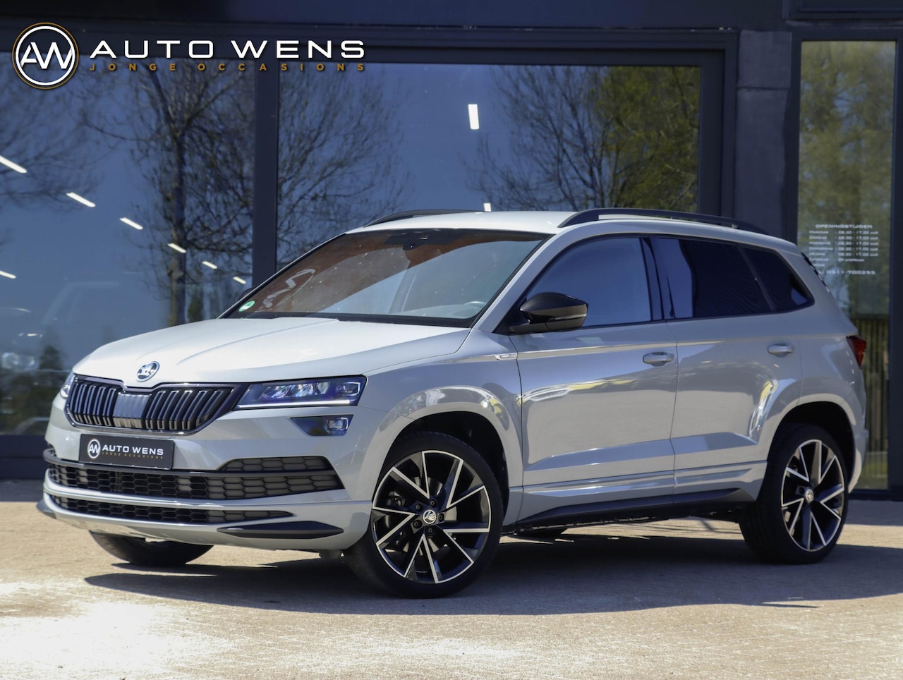 Skoda Karoq - 1.5 TSI ACT Sportline DSG Adapt. Cruise Trekhaak Winterpakket - AutoWereld.nl