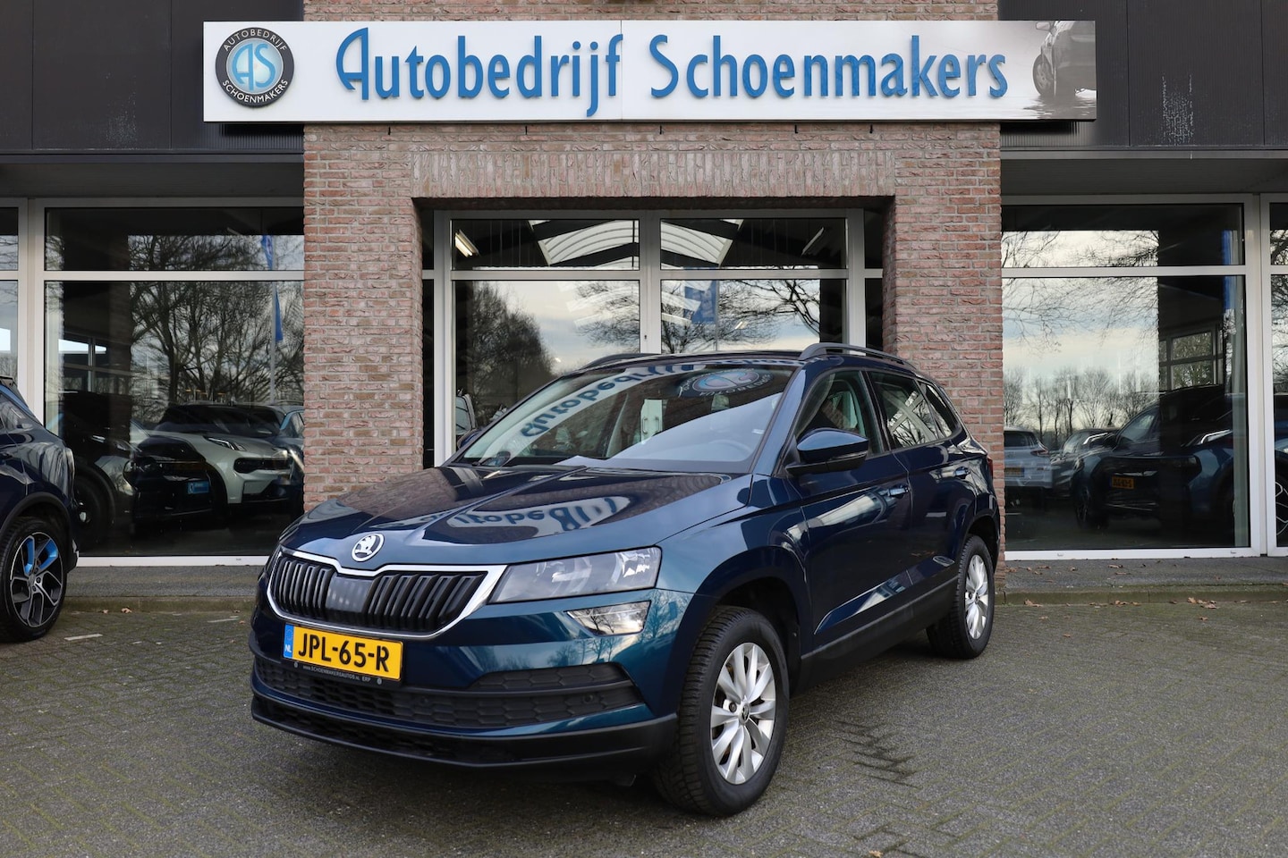 Skoda Karoq - 1.0 TSI Business Edition CARPLAY CAMERA SFEERVERL. STOELVERW. DAB CRUISE CLIMA NAVI 2XPDC - AutoWereld.nl