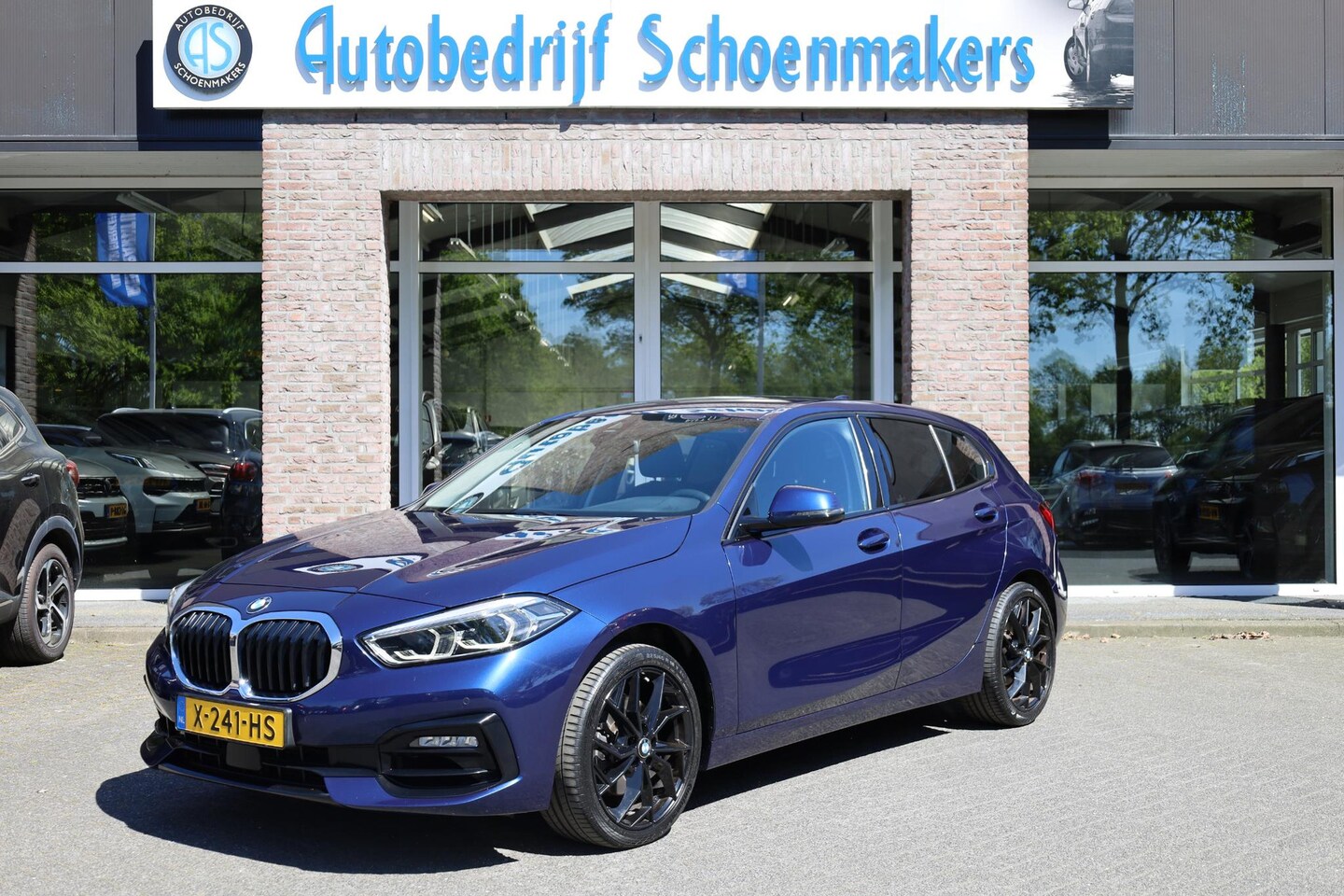 BMW 1-serie - 118i High Executive STOELVERWARMING 18"LMV CRUISE NAVI 2xPDC CLIMA HALFLEER M-STUUR - AutoWereld.nl