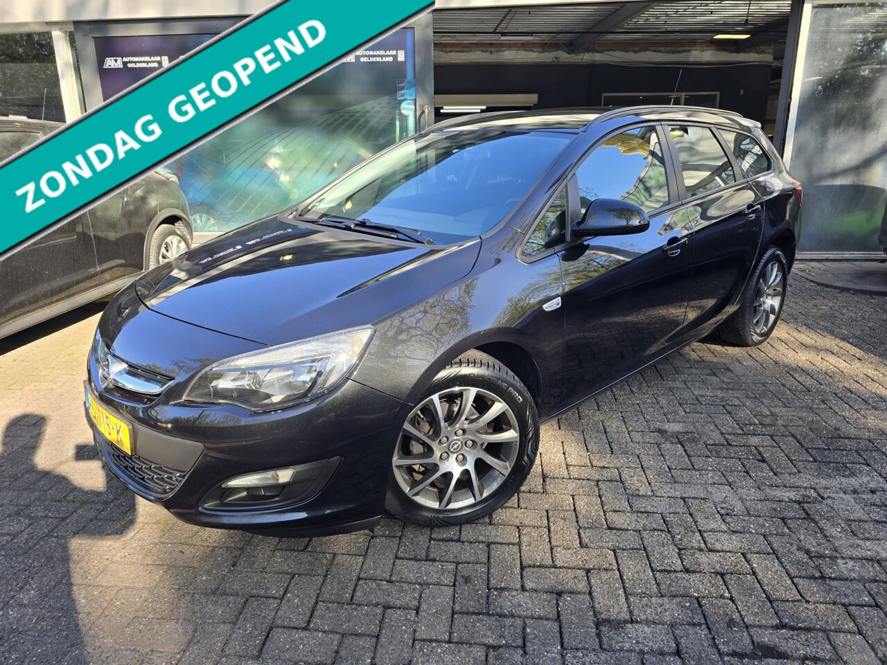 Opel Astra Sports Tourer - 1.4 Turbo Edition | AUTOMAAT | 12MND GARANTIE | AIRCO | CRUISE | LMV | - AutoWereld.nl