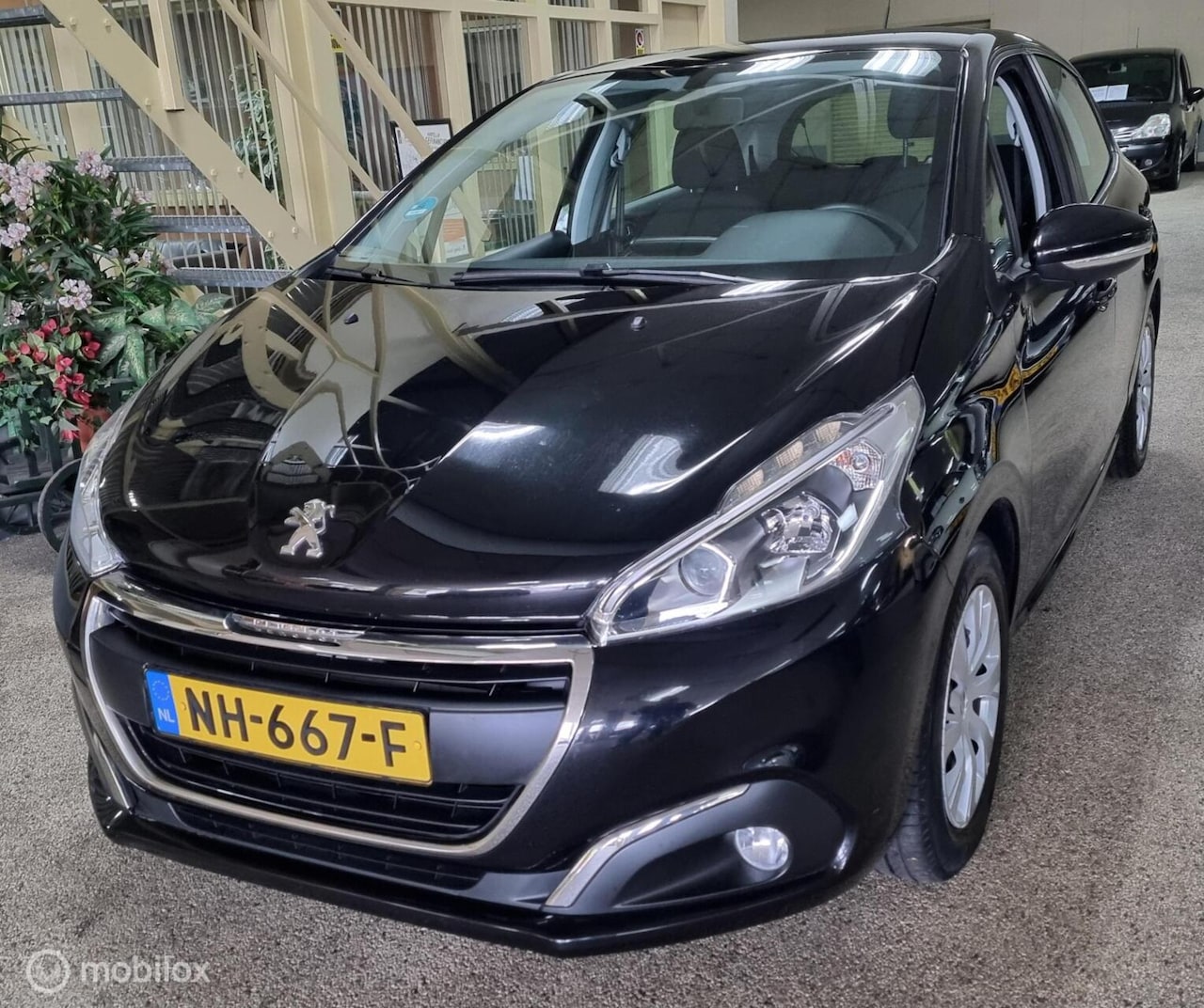 Peugeot 208 - 1.2 PureTech Blue Lion Navi - AutoWereld.nl