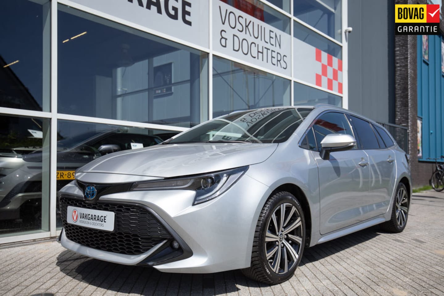 Toyota Corolla Touring Sports - 1.8 Hybrid Dynamic Style - AutoWereld.nl