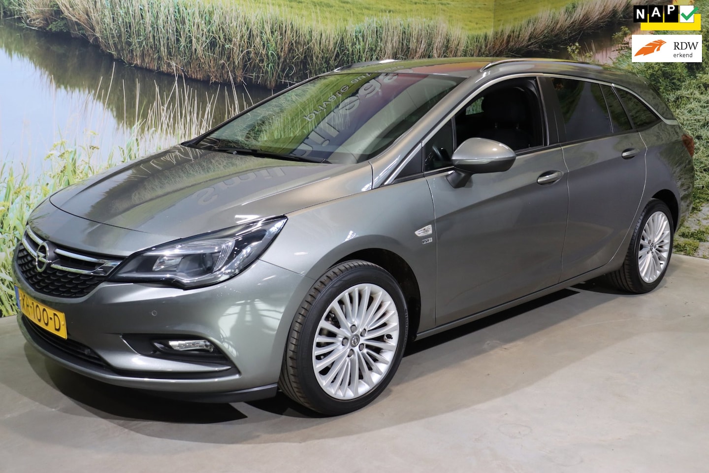 Opel Astra Sports Tourer - 1.4 Turbo 120 Jaar Edition|17 inch velgen|Trekhaak|Navi|Climate - AutoWereld.nl