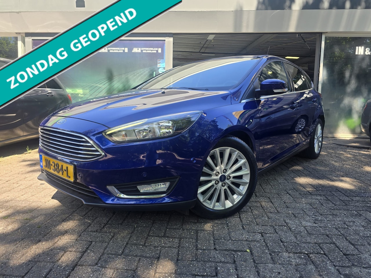 Ford Focus - 1.0 Titanium | 2E EIGENAAR | 12MND GARANTIE | AIRCO | CRUISE | NAVI | LMV | - AutoWereld.nl
