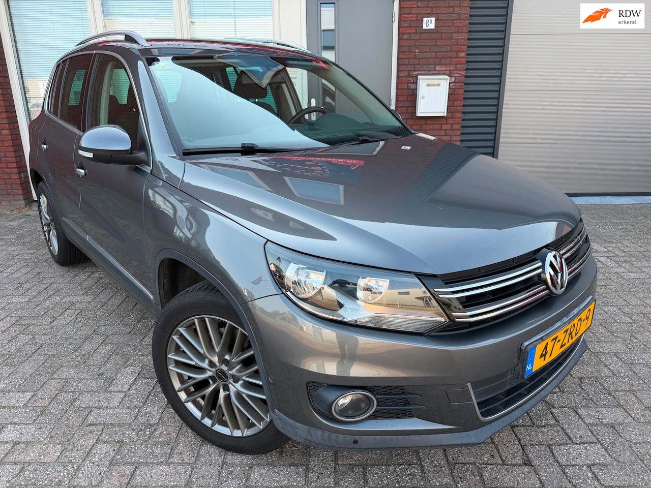 Volkswagen Tiguan - 1.4 TSI Sport&Style / Park Assist / Navi / PDC / Keyless / Cruise - AutoWereld.nl