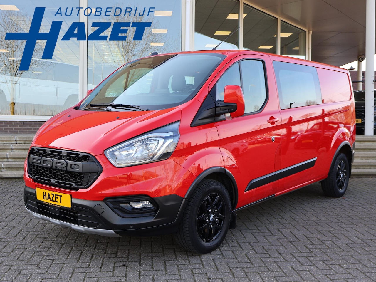 Ford Transit Custom - 320 2.0 TDCI 130 PK TRAIL DUBBEL CABINE L2H1 6-PERS. + LEDER | RAPTOR GRILLE | CARPLAY | C - AutoWereld.nl