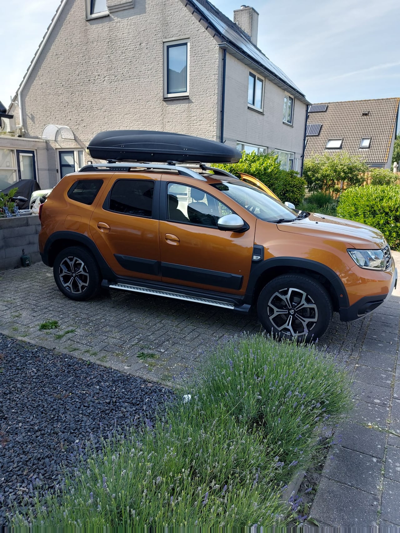 Dacia Duster - 1.0 TCe Bi-Fuel Prestige LPG, Sidebars, trekhaak en dakkoffer - AutoWereld.nl