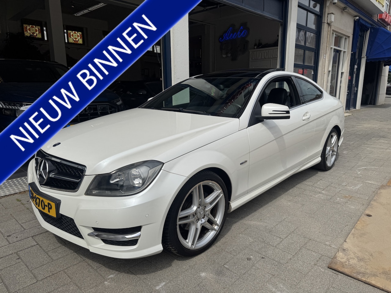 Mercedes-Benz C-klasse Coupé - 180 Ambition AMG/PANORAMA/LEDER - AutoWereld.nl