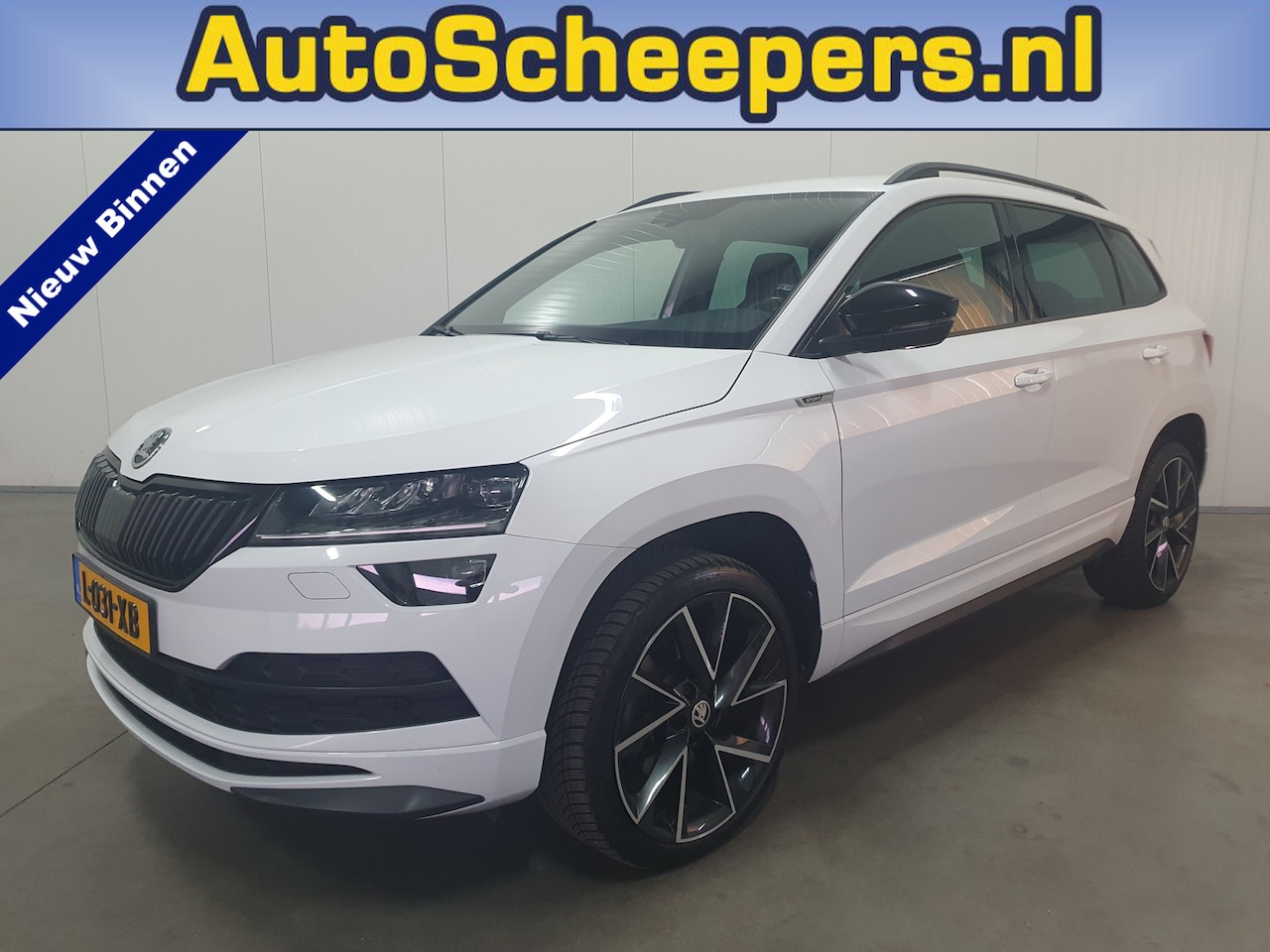 Skoda Karoq - 1.5 TSI ACT Sportline Business NAVI/LED/PDC/TRHAAK/LMV - AutoWereld.nl