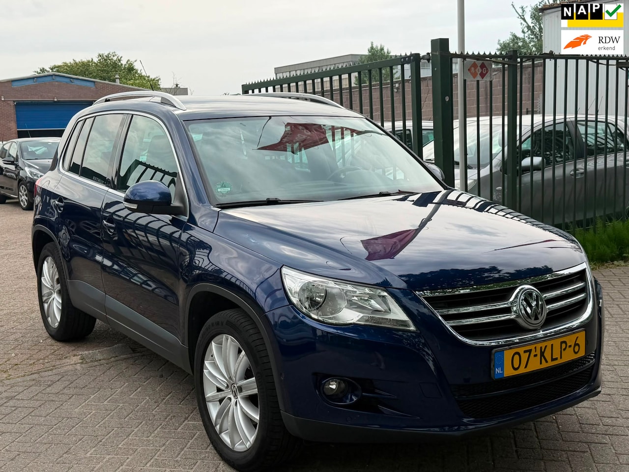 Volkswagen Tiguan - 2.0 TSI Sport&Style 4Motion 2e eigenaar dealer onderhouden airco trekhaak parkeer sensor n - AutoWereld.nl
