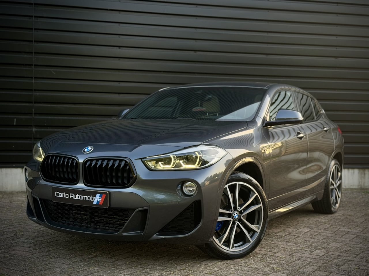 BMW X2 - sDrive20i M-SPORT PANO|HUD|H/K|CAMERA|KEYLESS - AutoWereld.nl