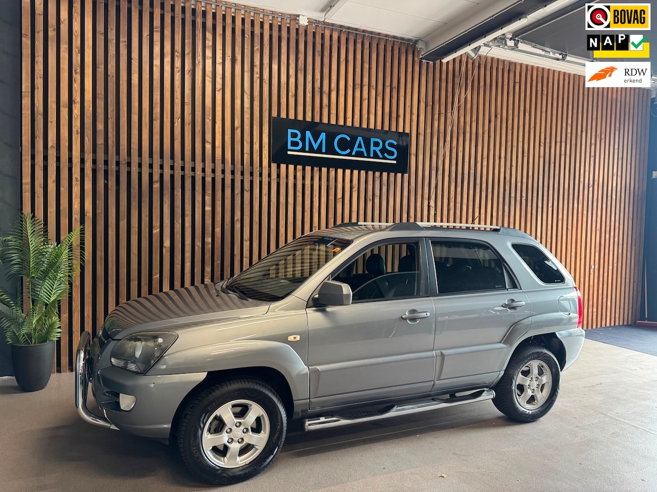 Kia Sportage - 2.0 CVVT X-cite Airco, BULL-SIDE BARS, Leer - AutoWereld.nl