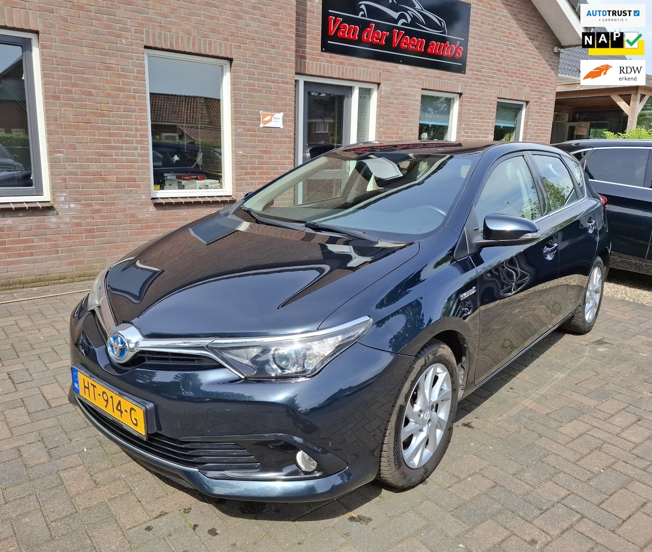 Toyota Auris - 1.8 Hybrid Aspiration. 1ste eigenaar, o.a. cruise, camera, isofix, aux. Zeer zuinige auto! - AutoWereld.nl