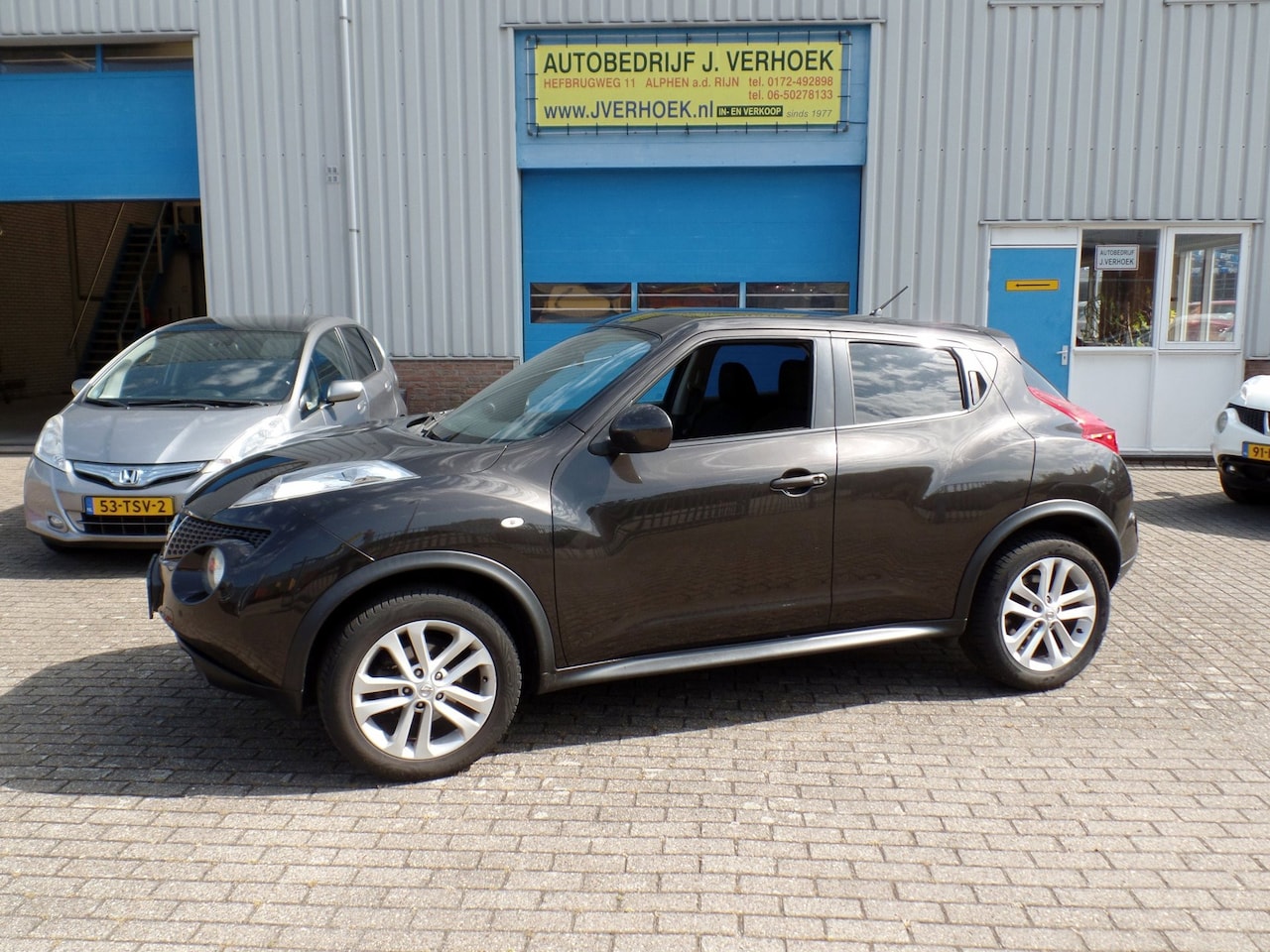Nissan Juke - 1.6 Acenta Eco zwart bruin metallic - AutoWereld.nl