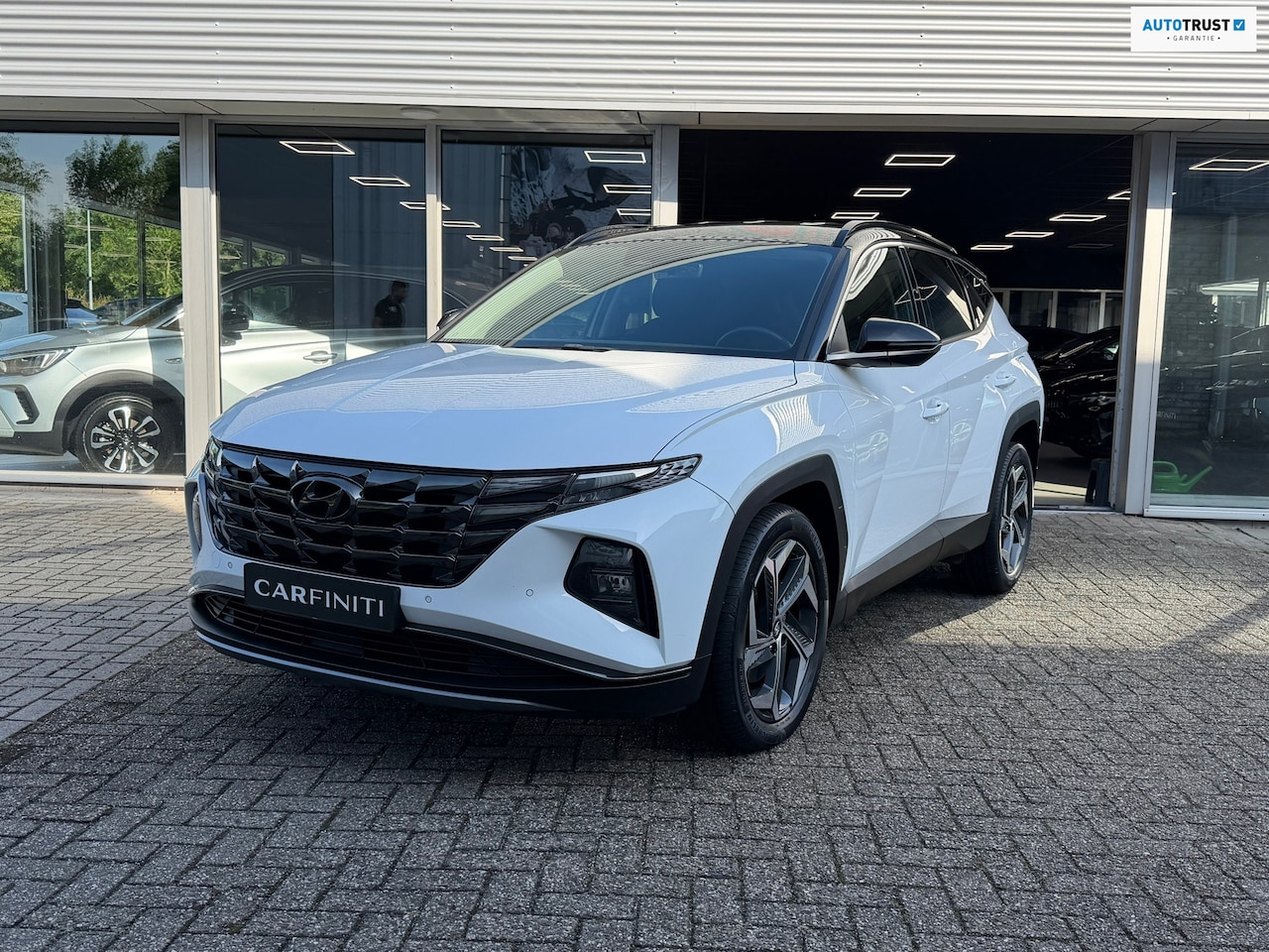 Hyundai Tucson - 1.6 T-GDI PHEV 265 Pk Comfort 4WD | Bicolor | Navigatie | Camera | Clima | Cruise | Keyles - AutoWereld.nl