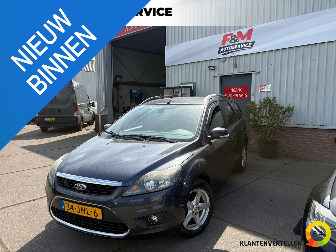 Ford Focus Wagon - 1.8 Titanium Flexi Fuel Clima, cruise, navi, pdc achter, trekhaak - AutoWereld.nl