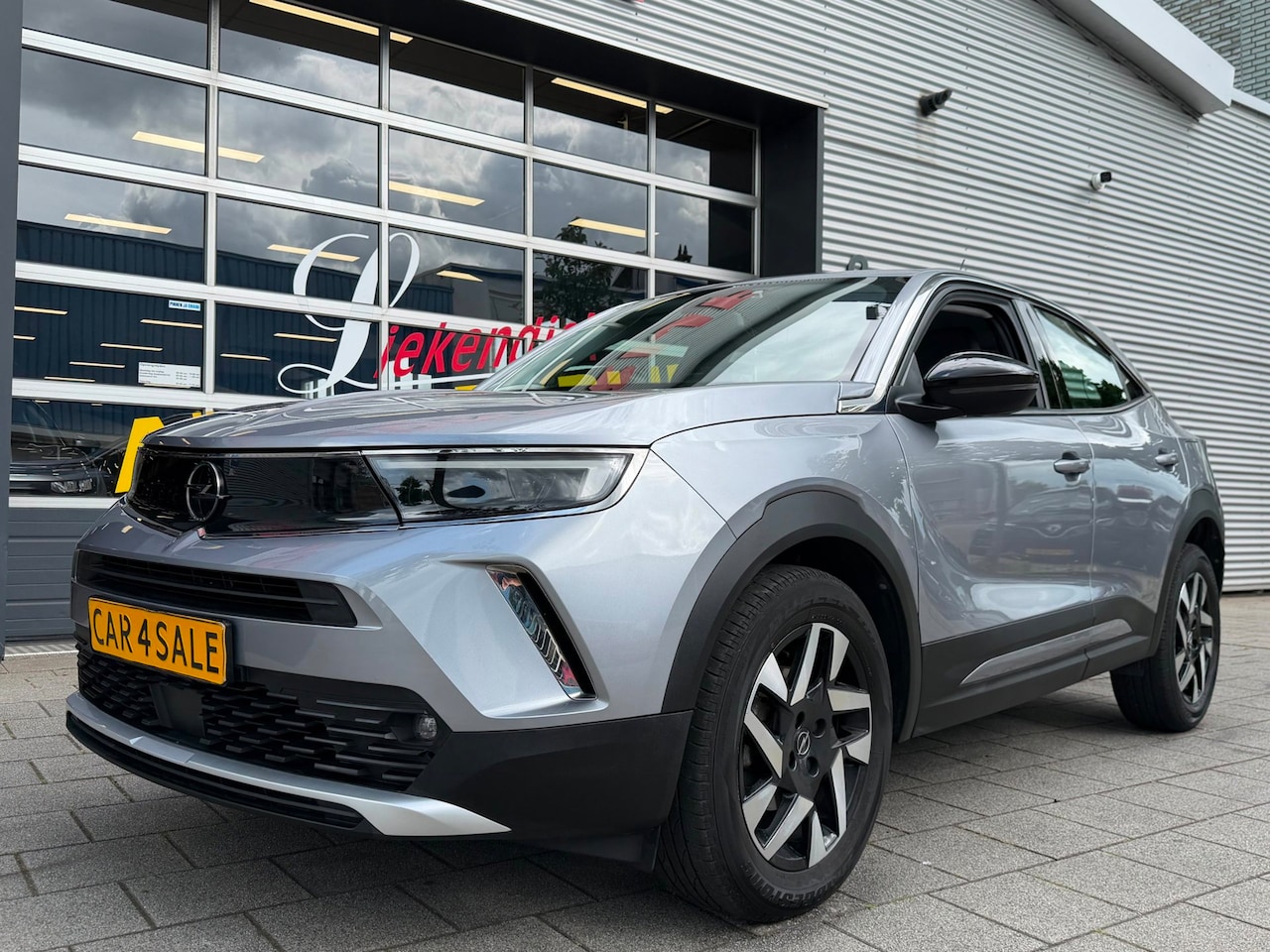 Opel Mokka - 1.2 Turbo Elegance - Navigatie / Apple CarPlay I Airco I LED I PDC I Sport velgen I Dealer - AutoWereld.nl