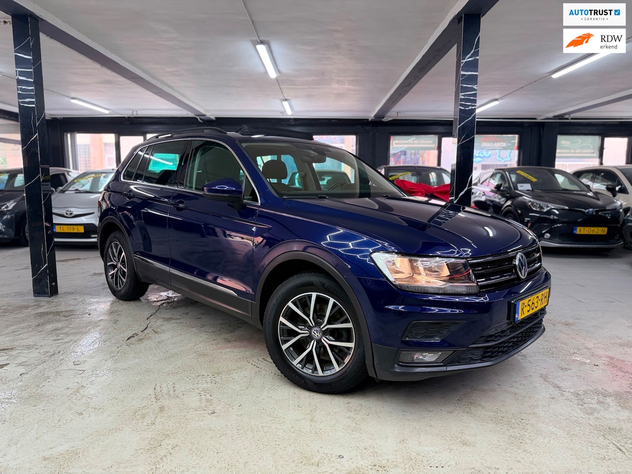 Volkswagen Tiguan - 1.4 TSI ACT Highline Business R Pano - AutoWereld.nl