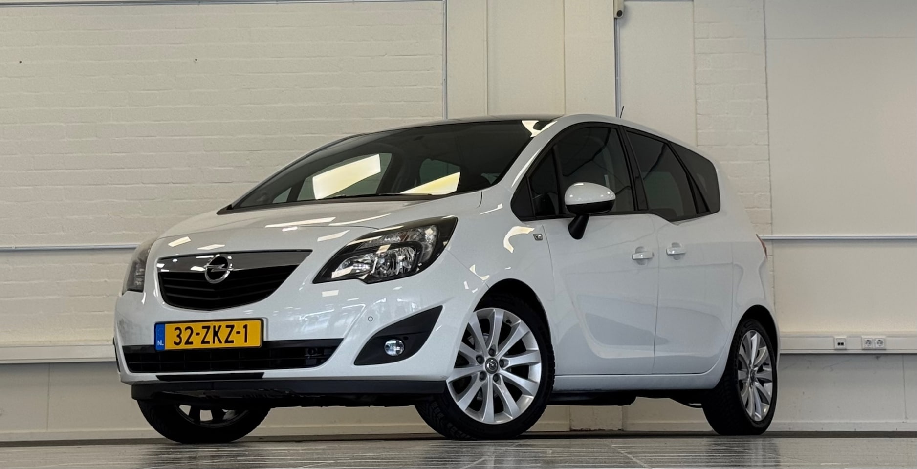Opel Meriva - 1.4 Turbo Cosmo Executive Navi Parkeerhulp voor & achter - AutoWereld.nl
