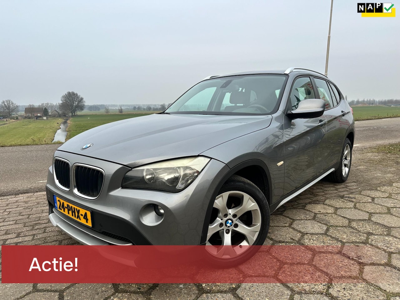 BMW X1 - 18i *ACTIE TOT €500 KORTING* 5D NAP AIRCO NAVI SCHERM TREKHAAK NW APK VELGEN ELEK.RAMEN - AutoWereld.nl