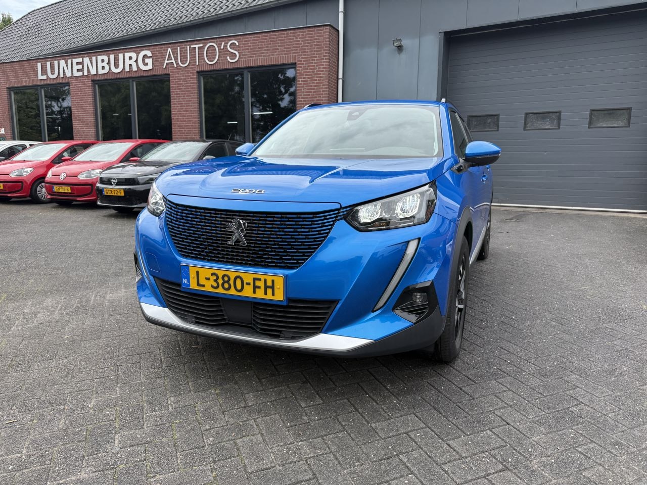 Peugeot e-2008 - EV Blue Lease Allure 50 kWh 10702 EURO EX BTW - AutoWereld.nl