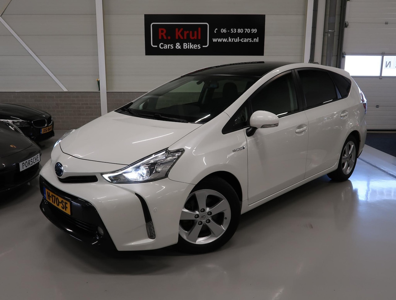 Toyota Prius - 1.8 Dynamic 7 Zitplaatsen Panoramadak Camera Head-Up Navigatie Airco-ecc Stoelverwarming L - AutoWereld.nl