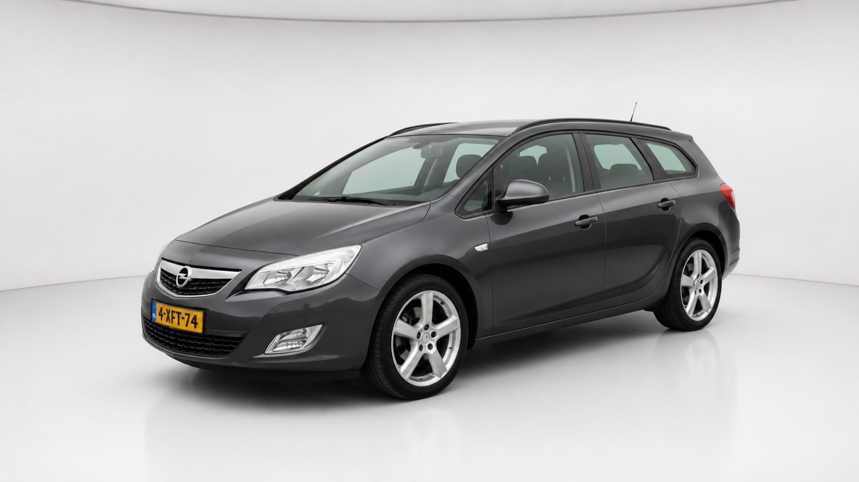 Opel Astra Sports Tourer - 1.4 Turbo Airco Cruise Trekhaak - AutoWereld.nl