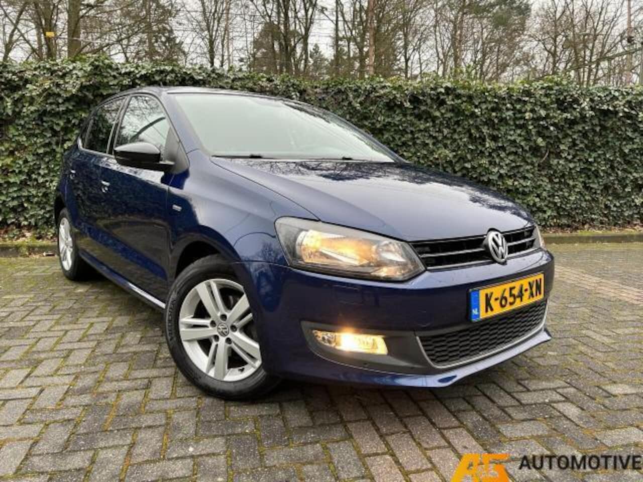 Volkswagen Polo - 1.2 5DRS Blauw 2012 | Airco | Cruise | PDC | Stoelverwarming | - AutoWereld.nl