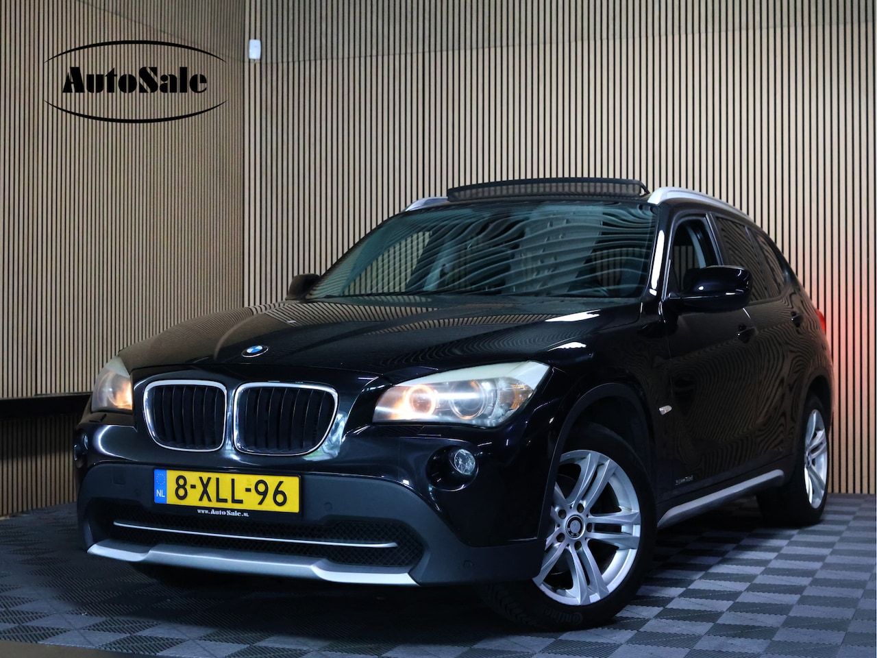 BMW X1 - sDrive18d Business AUTOM PANO NAVI CLIMA PDC CRUISE THAAK STOELVW '11 - AutoWereld.nl