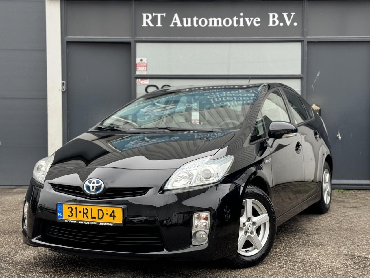 Toyota Prius - 1.8 Comfort Navi / Cruise / Clima HUD Dealer OH - AutoWereld.nl