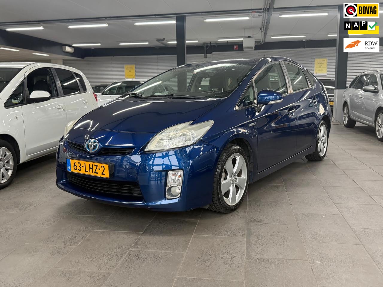 Toyota Prius - 1.8 Aspiration 1-eigenaar clima cruise control lm-velgen elektr-pakket parkeersensoren tre - AutoWereld.nl