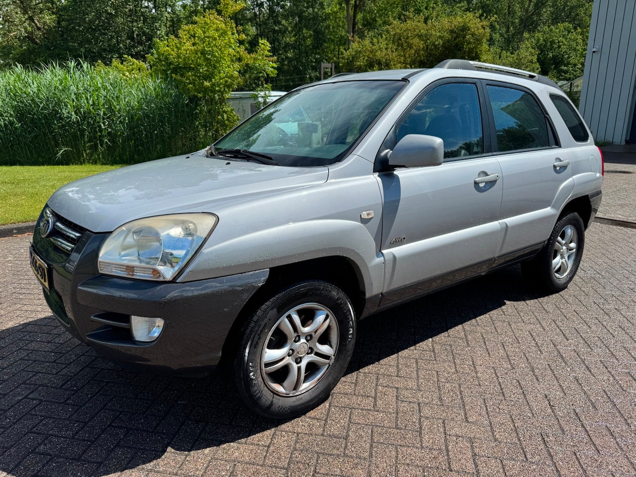 Kia Sportage - 2.0 CVVT Comfort AIRCO PARKEERSENSOR ACHTER NIEUWE APK/HALFLEDER - AutoWereld.nl