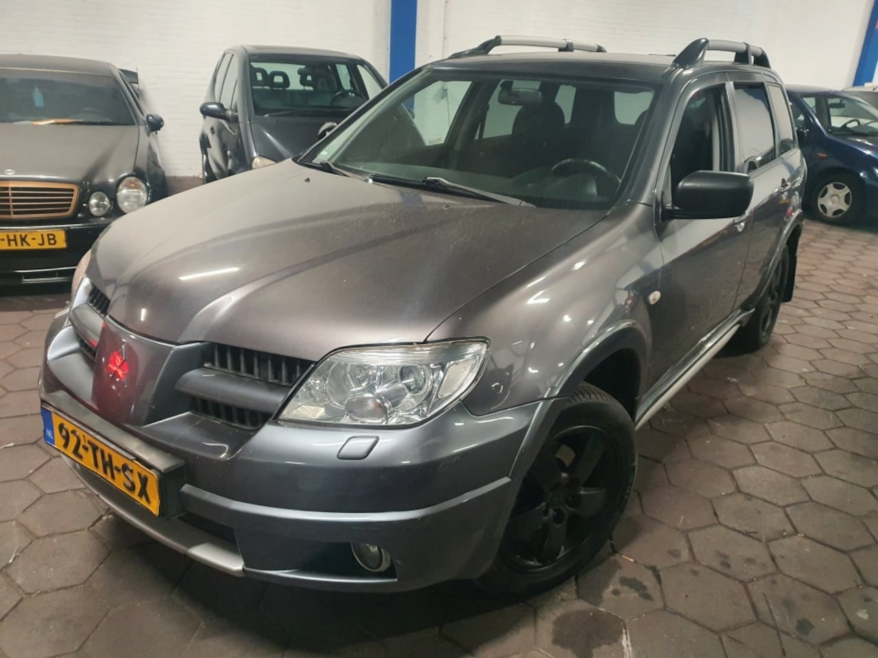 Mitsubishi Outlander Sport - 2.4 Invite Scott 4WD AUTOMAAT|AIRCO|G3|APK|2006 - AutoWereld.nl