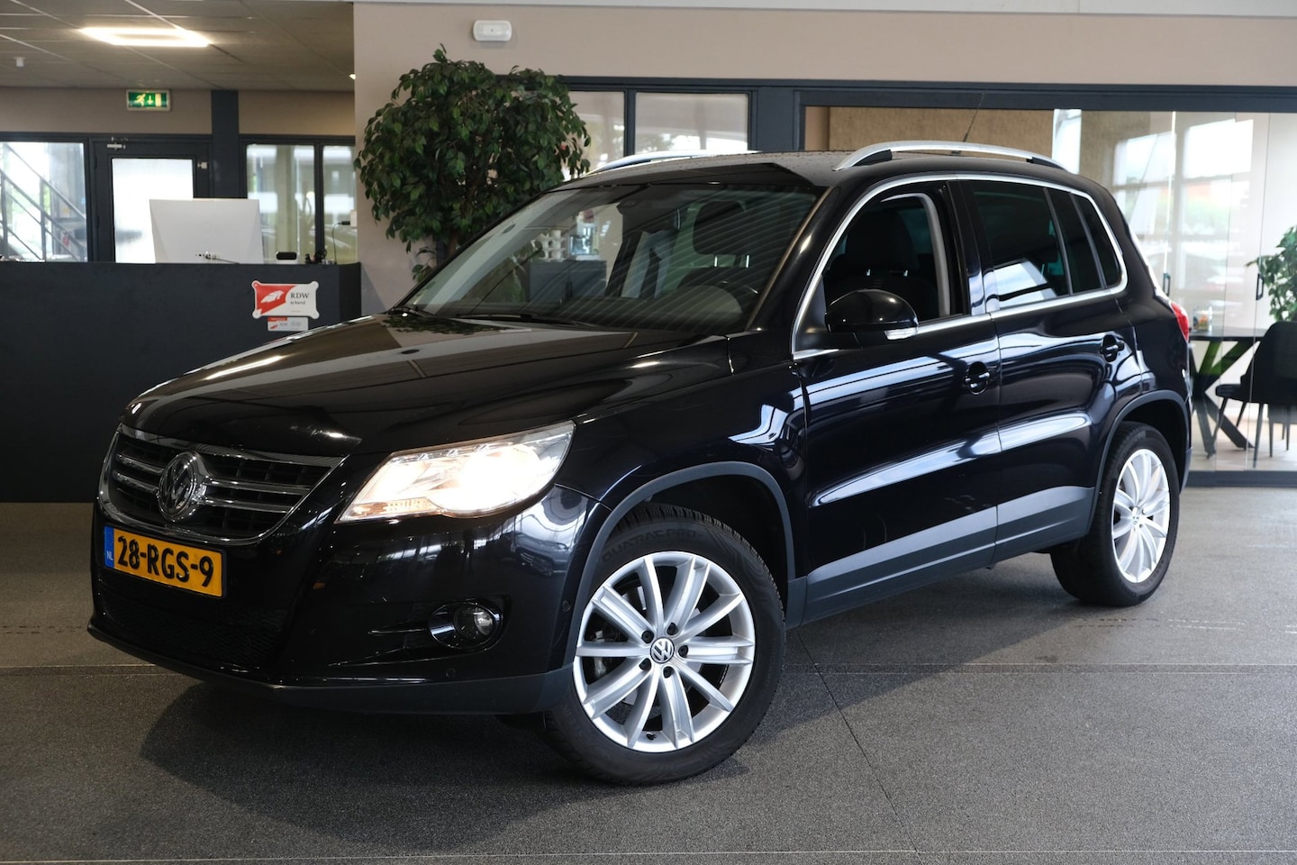 Volkswagen Tiguan - 1.4 TSI Sport&Style Navi Cruise Pdc - AutoWereld.nl