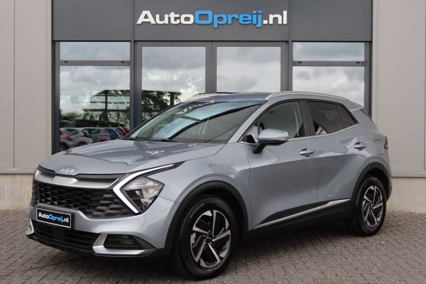 Kia Sportage - 1.6 T-GDi MHEV Hybrid AUTOMAAT DynamicLine NAVI, Camera, Stoel/stuur verwarming - AutoWereld.nl