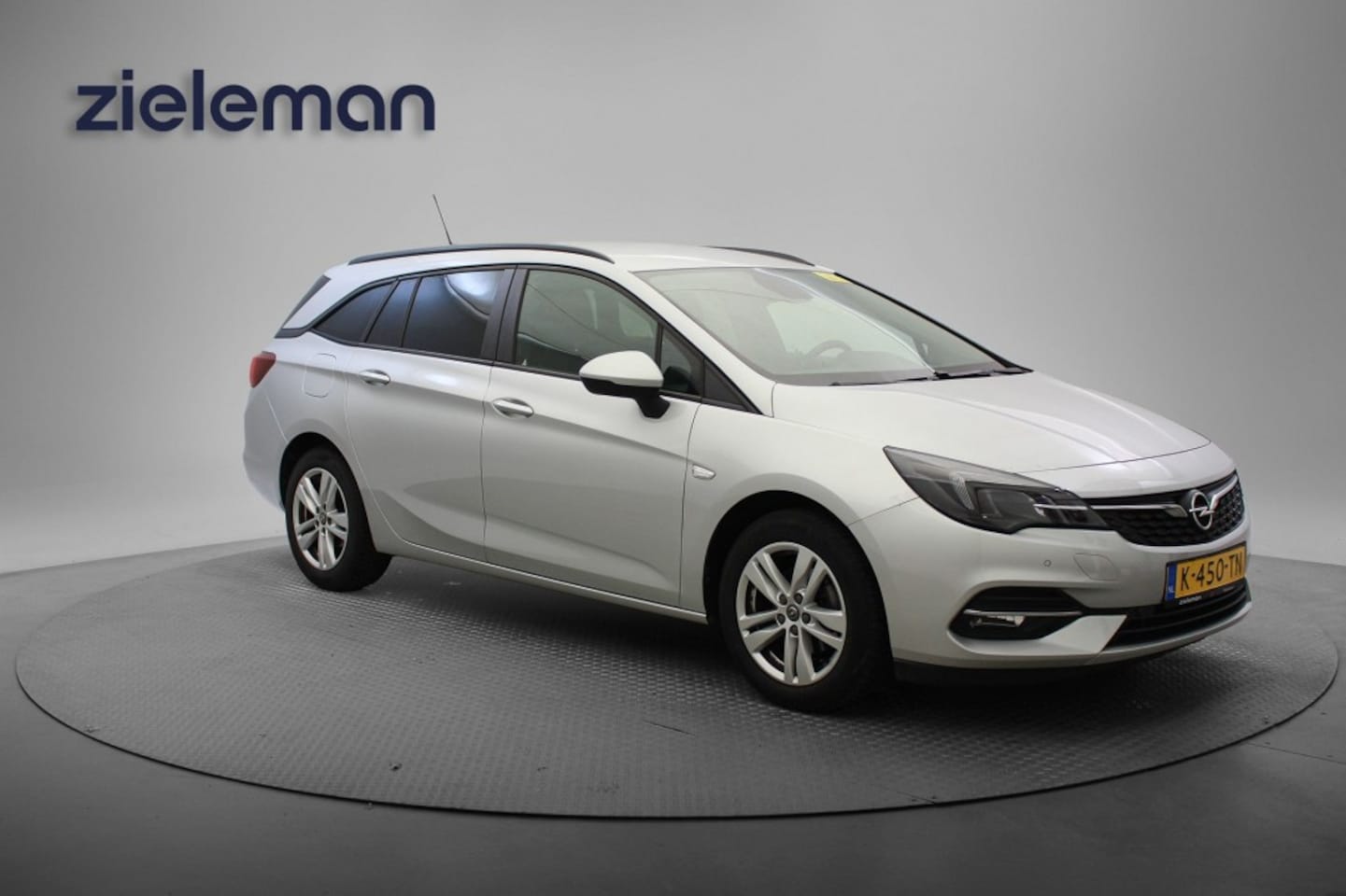 Opel Astra Sports Tourer - 1.2 Business Edition - Carplay, Cruise, Navi, Trekhaak, PDC - AutoWereld.nl