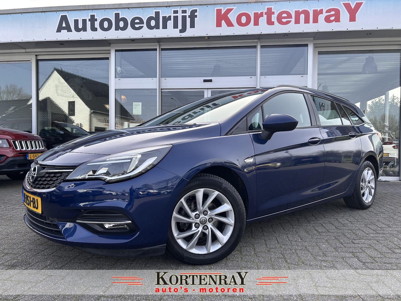 Opel Astra Sports Tourer - 1.2 Edition /achteruitrij camera/airco/navi/cruise control/carplay/pdc - AutoWereld.nl