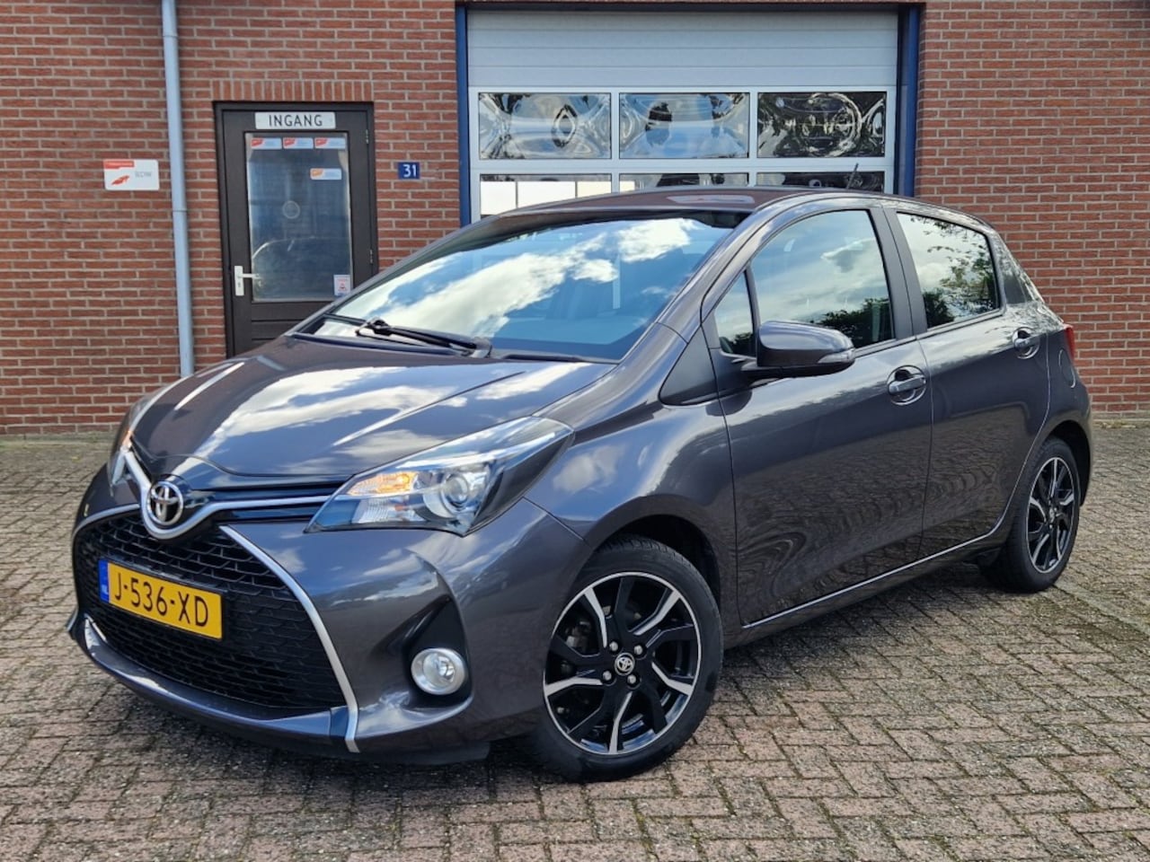 Toyota Yaris - 1.3 VVT-i Lounge 5-drs Airco Navi Camera Trekhaak L.m.v. - AutoWereld.nl